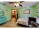 Bedroom with a bed, dresser, and ensuite bathroom at 7255 18Th Ne St, St Petersburg, FL 33702