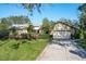Well-maintained one-story home boasting a two-car garage, green lawn, and mature landscaping at 7255 18Th Ne St, St Petersburg, FL 33702
