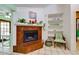 Cozy corner fireplace with tile surround and decorative shelving at 7255 18Th Ne St, St Petersburg, FL 33702