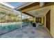 Enclosed patio with a pool, ceiling fans, and outdoor dining set at 7255 18Th Ne St, St Petersburg, FL 33702