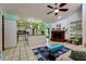 Open-concept living space featuring a fireplace, kitchen, and comfortable seating area at 7255 18Th Ne St, St Petersburg, FL 33702