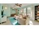 Cozy living room with a large window, comfortable furniture, and a ceiling fan at 7255 18Th Ne St, St Petersburg, FL 33702