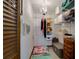 Bright walk-in closet with a chandelier, shelving, and storage containers at 7255 18Th Ne St, St Petersburg, FL 33702