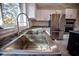 Farmhouse sink with modern gooseneck faucet at 1042 Idlewild N Dr, Dunedin, FL 34698
