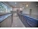 Updated kitchen with an island, stainless steel appliances, and granite counters at 1042 Idlewild N Dr, Dunedin, FL 34698