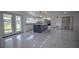 Updated kitchen with an island, white cabinets, and stainless steel appliances at 1042 Idlewild N Dr, Dunedin, FL 34698