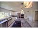 Modern kitchen with stainless steel appliances and granite countertops at 1042 Idlewild N Dr, Dunedin, FL 34698