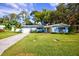 Newly renovated light blue home with a spacious yard at 1042 Idlewild N Dr, Dunedin, FL 34698