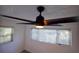 Bedroom with ceiling fan and window blinds at 1042 Idlewild N Dr, Dunedin, FL 34698