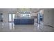 Modern kitchen with dark cabinetry, granite countertops, and stainless steel appliances at 1042 Idlewild N Dr, Dunedin, FL 34698