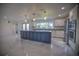 Modern kitchen featuring stainless steel appliances, granite countertops, and a large island at 1042 Idlewild N Dr, Dunedin, FL 34698