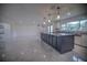 Updated kitchen featuring a large island, granite countertops, and pendant lighting at 1042 Idlewild N Dr, Dunedin, FL 34698