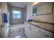 Modern bathroom, granite countertop and tile at 1042 Idlewild N Dr, Dunedin, FL 34698