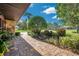 Landscaped side yard with brick pavers and lush greenery at 12011 N Gomez Ave, Tampa, FL 33618