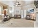 Spacious living room with comfortable seating and large windows, offering ample natural light at 12709 Mannhurst Oak Ln, Lithia, FL 33547