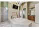 Elegant Primary bathroom with a spacious soaking tub at 12709 Mannhurst Oak Ln, Lithia, FL 33547