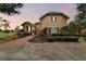 Two-story house with a large driveway and mature landscaping at 12709 Mannhurst Oak Ln, Lithia, FL 33547