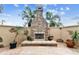 Stone fireplace in a cozy outdoor patio setting at 12709 Mannhurst Oak Ln, Lithia, FL 33547
