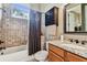 Updated bathroom features granite countertops, tile shower, and updated fixtures at 12709 Mannhurst Oak Ln, Lithia, FL 33547