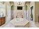 Primary bathroom with walk-in shower and large tub at 12709 Mannhurst Oak Ln, Lithia, FL 33547