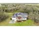 Home with solar panels, patio, and a large backyard at 12709 Mannhurst Oak Ln, Lithia, FL 33547