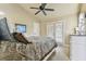 Bright bedroom with a queen bed and access to private balcony at 12709 Mannhurst Oak Ln, Lithia, FL 33547
