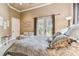Main bedroom with French doors and sitting area at 12709 Mannhurst Oak Ln, Lithia, FL 33547