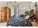 Bedroom with king-size bed, and large wardrobe at 12709 Mannhurst Oak Ln, Lithia, FL 33547