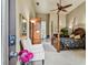 Bedroom with king-size four poster bed and sitting area at 12709 Mannhurst Oak Ln, Lithia, FL 33547