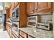 Well-equipped kitchen with double ovens and granite countertops at 12709 Mannhurst Oak Ln, Lithia, FL 33547