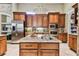Island kitchen with granite countertops and stainless steel appliances at 12709 Mannhurst Oak Ln, Lithia, FL 33547