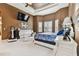 Spacious Primary bedroom with large bed and built-in features at 12709 Mannhurst Oak Ln, Lithia, FL 33547