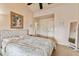 Light and bright bedroom with a king-size bed and plenty of natural light at 12709 Mannhurst Oak Ln, Lithia, FL 33547