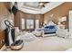 Primary bedroom featuring a king-size bed and TV at 12709 Mannhurst Oak Ln, Lithia, FL 33547