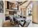 Outdoor kitchen with stone facade, grill, and dining area at 12709 Mannhurst Oak Ln, Lithia, FL 33547