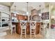 Large kitchen with an island, ample counter space, and rich wood cabinetry at 12709 Mannhurst Oak Ln, Lithia, FL 33547