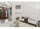 Sitting area with two chairs and a glass-top coffee table at 12709 Mannhurst Oak Ln, Lithia, FL 33547