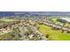 Aerial view of homes near golf course and lake at 13141 Palmilla Cir, Dade City, FL 33525