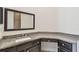 Bathroom boasts granite vanity and a large mirror at 13141 Palmilla Cir, Dade City, FL 33525