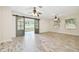 Open living area with barn doors and wood-look flooring at 13141 Palmilla Cir, Dade City, FL 33525