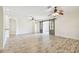 Spacious living room featuring wood-look floors and ceiling fans at 13141 Palmilla Cir, Dade City, FL 33525