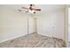 Spacious bedroom with wood-look floors and double closets at 13141 Palmilla Cir, Dade City, FL 33525