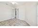 Well-lit bedroom with hardwood floors and French doors at 13141 Palmilla Cir, Dade City, FL 33525