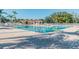 Resort-style community pool with plenty of space for lounging at 13141 Palmilla Cir, Dade City, FL 33525
