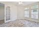 Bright bedroom with hardwood floors and large windows at 13141 Palmilla Cir, Dade City, FL 33525