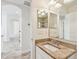 Updated bathroom vanity with granite countertop and mirror at 13141 Palmilla Cir, Dade City, FL 33525