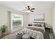 Cozy bedroom with wood-look floors and neutral decor at 13141 Palmilla Cir, Dade City, FL 33525