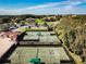 Aerial view of well-maintained tennis courts at 13141 Palmilla Cir, Dade City, FL 33525