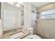 Clean bathroom with granite countertop and shower/tub combo at 13141 Palmilla Cir, Dade City, FL 33525