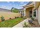 Front entry with walkway, landscaping, and columns at 13141 Palmilla Cir, Dade City, FL 33525